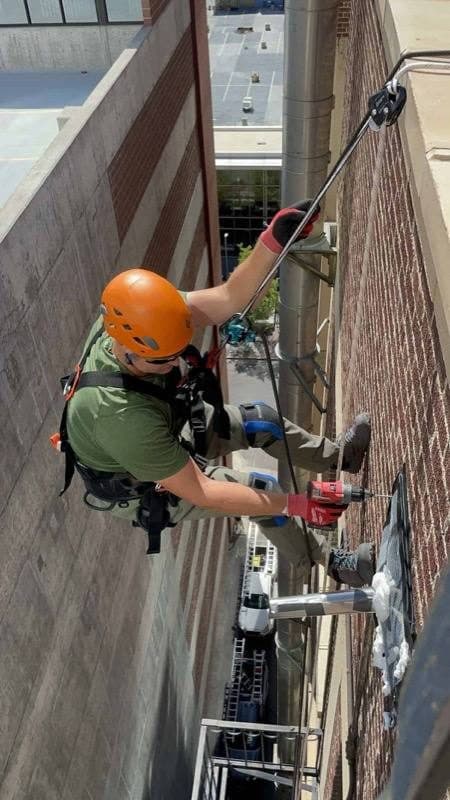 Colorado Wildlife Specialists technician at work on a bat removal job